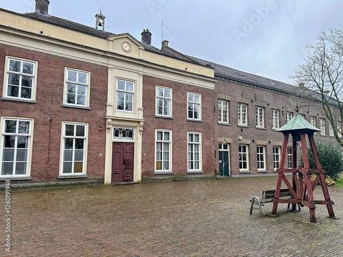 The Kruisberg, a former penitentiary in Doetinchem with a small bell chair with a copper roof at the entrance. photo