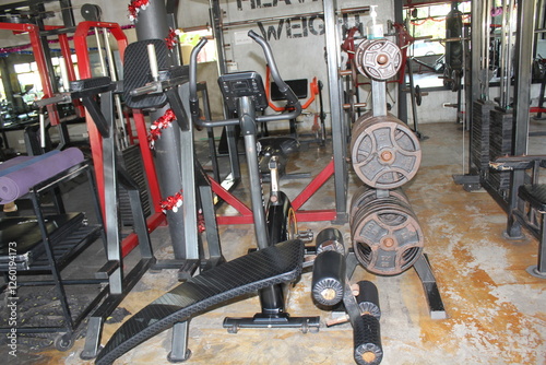 A gym is a facility equipped with exercise machines, free weights, and fitness areas designed for physical training and wellness. It provides an environment for individuals to engage in strength train