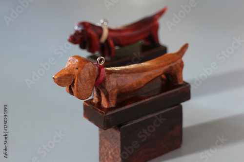 dachshund dogs with collars, wooden figures photo