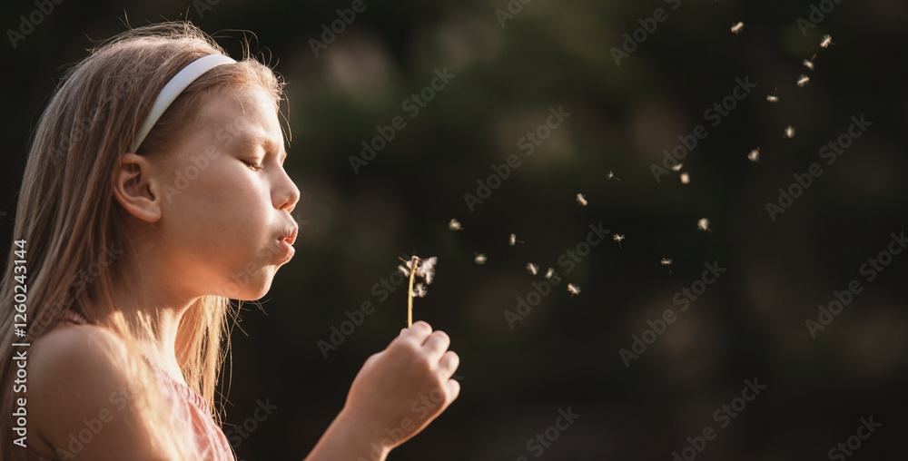 Little girl sitting on grass blowing on dandelion. Freedom to breathe, allergy treatment, hay fever, pollen allergy. Asthma copy space Little girl sitting on grass blowing on dandelion. Freedom to breathe, allergy treatment, hay fever, pollen allergy. Asthma copy space