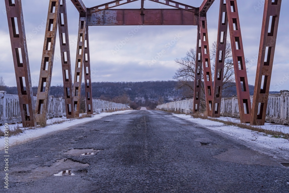 Obraz premium Metal construction of the old bridge across the river. Elements of the metal construction of the bridge.