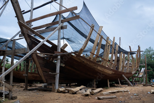 Traditional wooden boat building in Indonesia. The construction of wooden ship in Indonesia