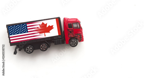 Miniature toy at table with white background. There is american flag on toy of truck. photo