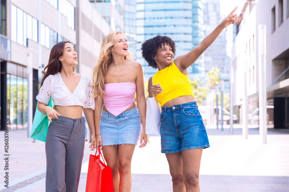 A group of three young women walk through a modern city street carrying shopping bags. One of them points excitedly at something while they all smile, enjoying a fun and lively shopping day. A group of three young women walk through a modern city street carrying shopping bags. One of them points excitedly at something while they all smile, enjoying a fun and lively shopping day.