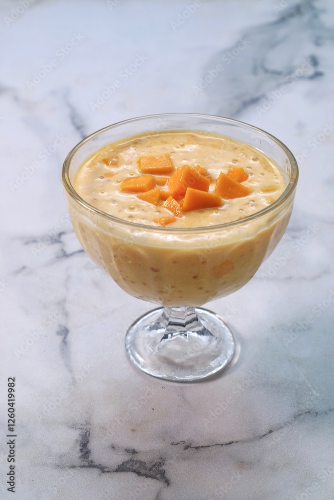 Mango Sago Dessert is Made from Puree Mango, Sago Pearl, and Coconut Milk top with Sliced Mango Mango Sago Dessert is Made from Puree Mango, Sago Pearl, and Coconut Milk top with Sliced Mango