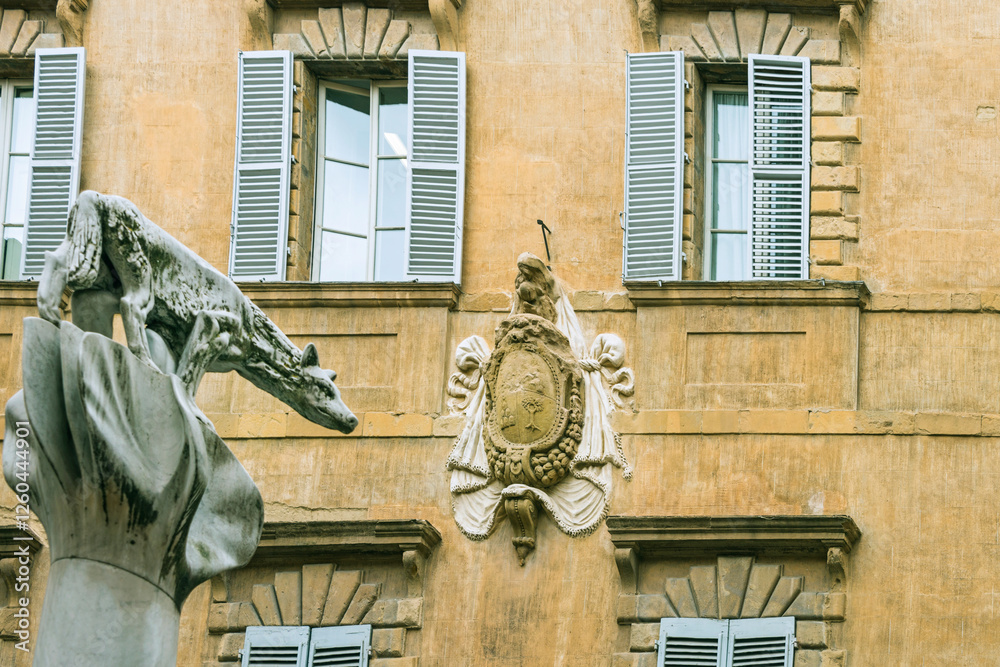 Obraz premium Facade of old buildings in the historical center of Siena, the UNESCO World Heritage Centre, unchanged for 13-14 centuries, with its medieval streets looked like in the early Middle Ages. Italy, 2019