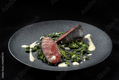 Perfectly roasted and skillfully served, the succulent meat contrasts with the melamelized crust and tender interior.