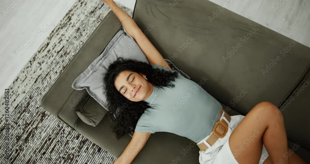 Above, woman and stretching on sofa for relax, wake up or self care in living room. Girl, peace and adjusting posture in home with calm, muscle tension relief and happy for well rested in apartment