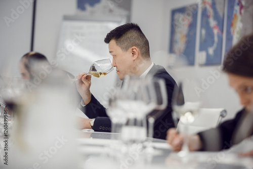 Blind wine tasting. Sommelier examination to get certificate professional work of winemaking. Sommelier degustate wine. photo