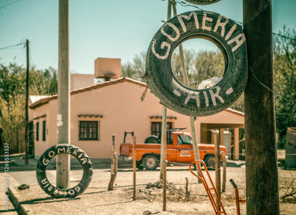 Fototapeta premium Tire repair on road route 40 in north west Argentina with a vintage old Ford.