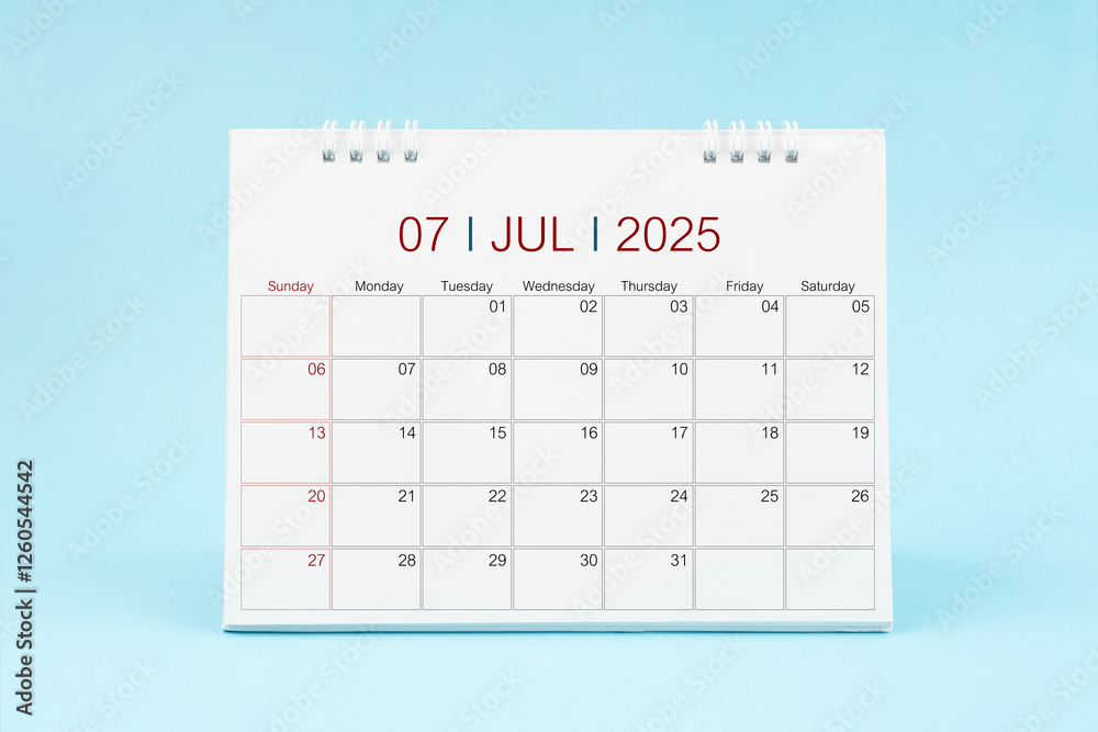 July 2025, Monthly desk calendar for 2025 year on Blue background. July 2025, Monthly desk calendar for 2025 year on Blue background.