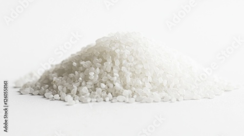 Pile of white rice grains on white background photo