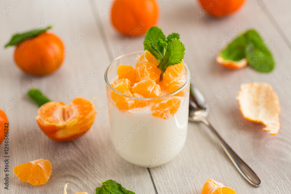 Milk dessert with tangerine pieces Milk dessert with tangerine pieces