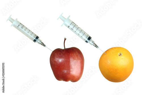 syringe fruit of red apple and orange as healthy food containing mineral and vitamin c
