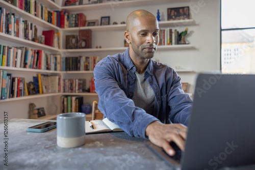 Man engaged in productive work at his desk photo