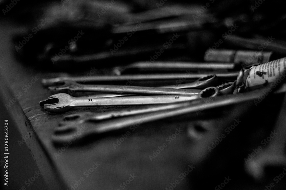 Fototapeta premium A close-up shot of scattered wrenches, highlighting their metallic texture and industrial form