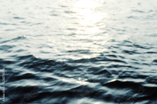 Water surface with ripples and sunlight reflections
