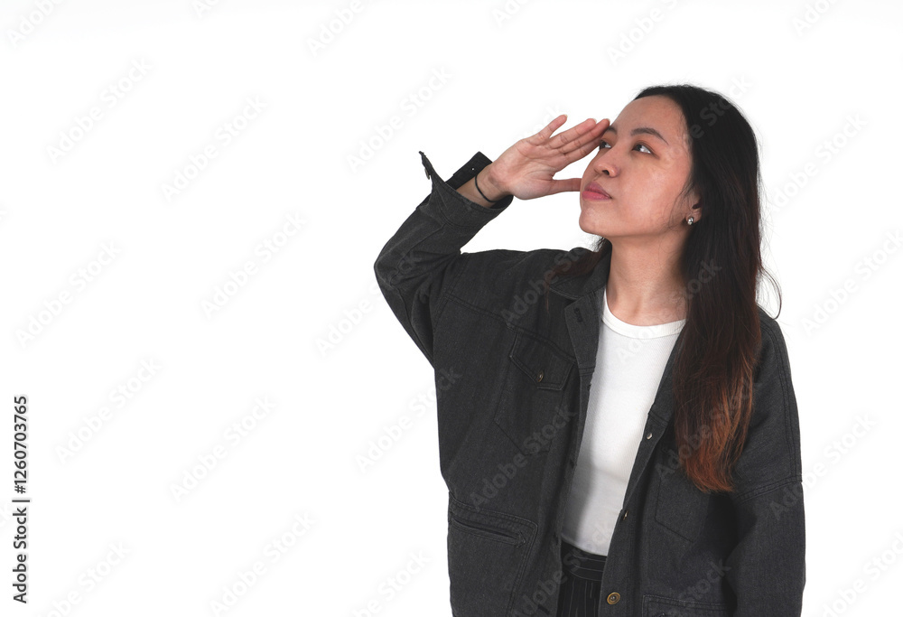 Young asian woman wearing black denim jacket with salute pose isolated on horizontal copy spaced white background. Young asian woman wearing black denim jacket with salute pose isolated on horizontal copy spaced white background.