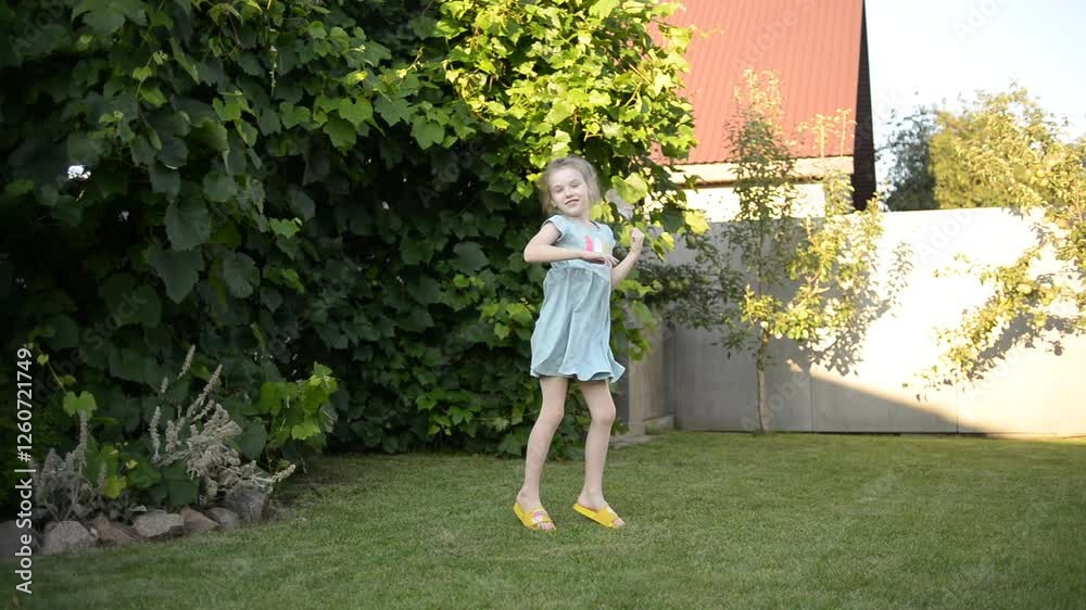 A joyful 7-year-old girl dancing happily in the yard of a house on a sunny summer day, expressing fun and freedom A joyful 7-year-old girl dancing happily in the yard of a house on a sunny summer day, expressing fun and freedom