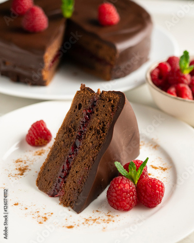 Sacher cake with raspberry filling and fresh raspberries