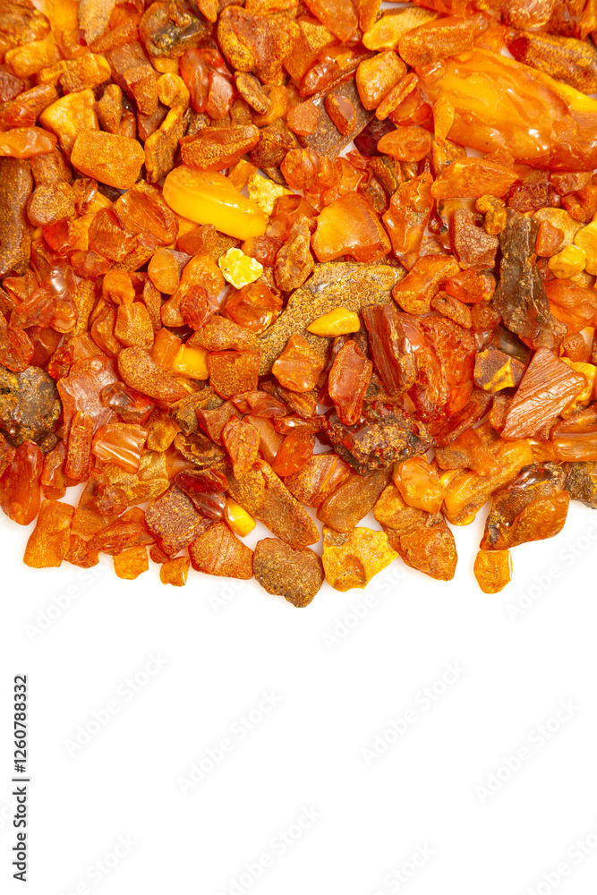 Close-up. Background. Amber from the coast of the Baltic Sea. Stack of raw amber on white background. Raw material for making jewelry. Close-up. Background. Amber from the coast of the Baltic Sea. Stack of raw amber on white background. Raw material for making jewelry.