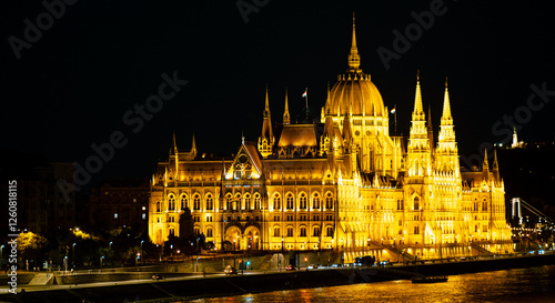 A grand and impressive Budapest's Parliament is illuminated at night photo