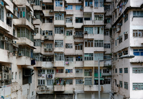 View of crowded narrow apartments in a residential tower of an old community in Quarry Bay, Hong Kong, a phenomenon of high housing density & severe housing shortage due to overpopulation in HK