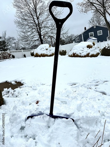 snow covered shovel