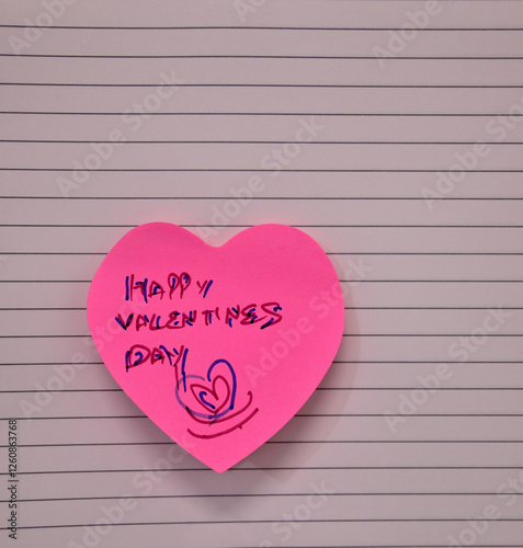 Pink heart-shaped sticky note with 