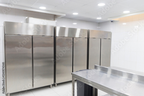 room with refrigeration equipment for cutting meat. place to store meat for a restaurant. interior of modern kitchen photo