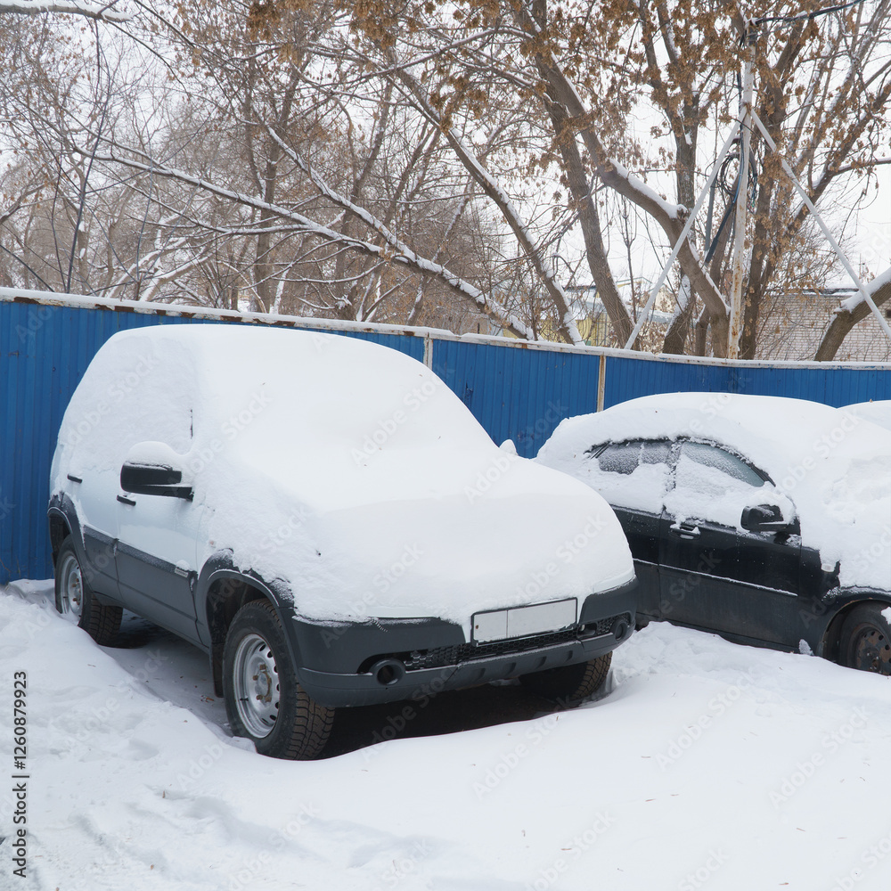 Cars covered with snow in Parking lot Cars covered with snow in Parking lot