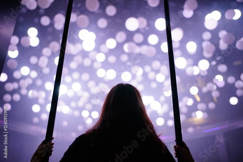 Woman looking at lights photo