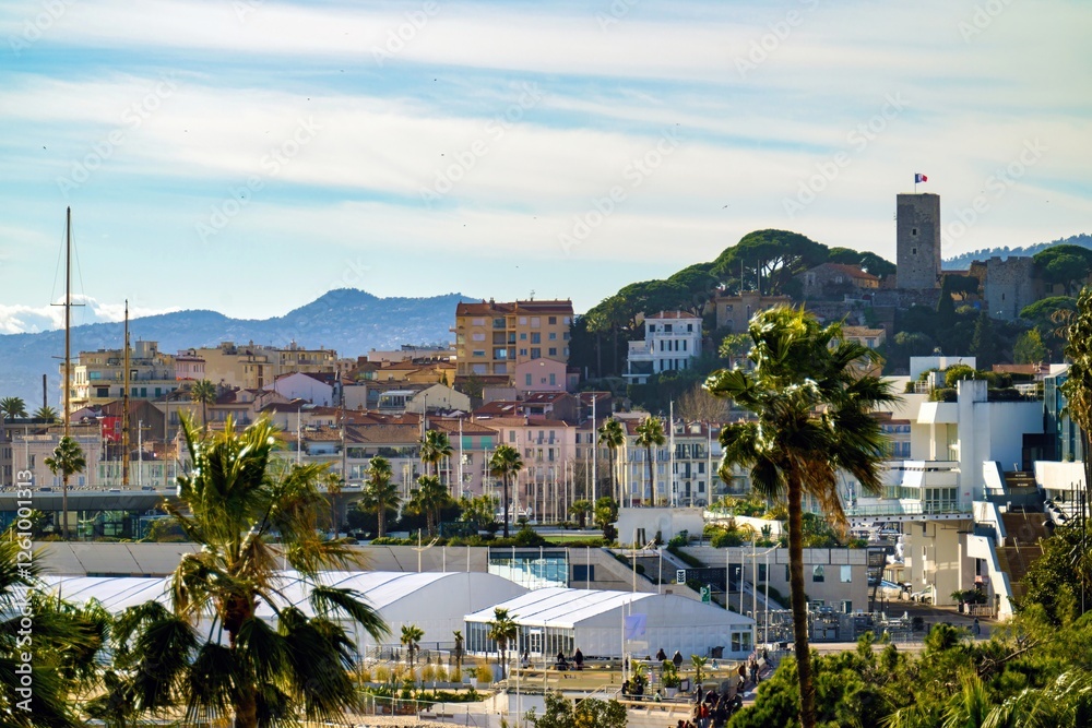 Cannes beach and castle, buildings and palm trees, France