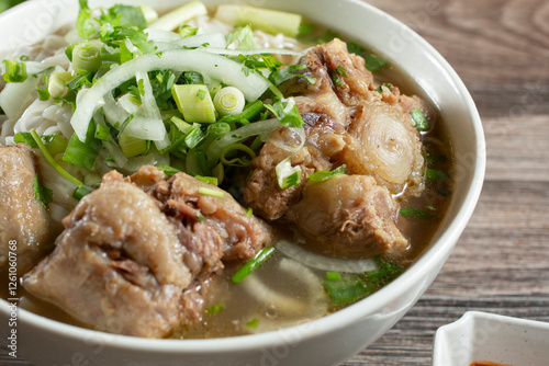 Photos A closeup view of a bowl of pho oxtail.