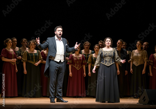 Performers singing in opera performance with actors in elegant costumes captivating the audience