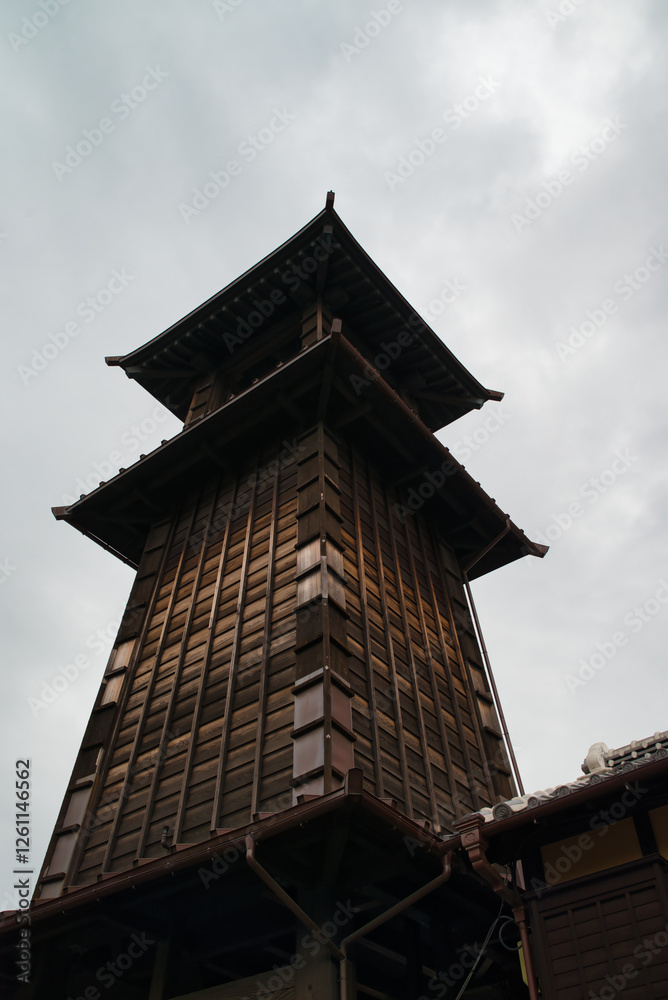 Vertical front view photograph of the bell tower (Toki no Kane) in the historic warehouse district of Kawagoe, Saitama Prefecture, Japan Asia.
Vertical front view photograph of the bell tower (Toki no Kane) in the historic warehouse district of Kawagoe, Saitama Prefecture, Japan Asia.