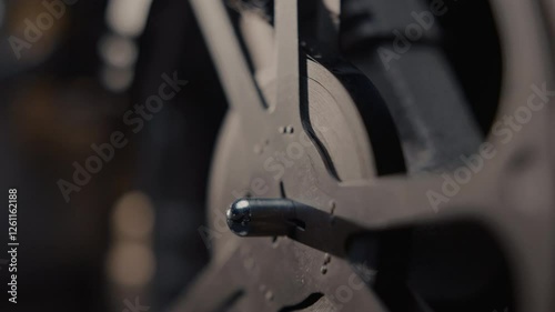 Close ups of a vintage 8MM projector spools moving and playing film 