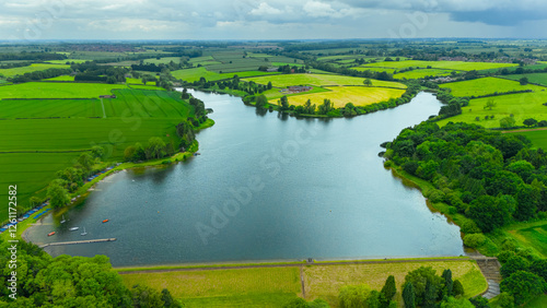  Cransley Reservoir with reflection of sky in water in England.	 photo