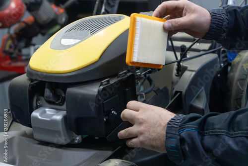 replacing the air filter on a lawn mower