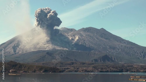 View over sea of an ash cloud eruption from Sakurajima volcano, Indonesia.