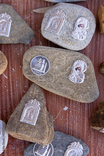 Religious Catholic souvenirs sold near a church on Tinos Island, Greece. 