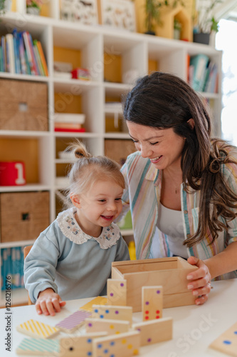 A young woman and a little girl work together on a wooden educational toy, engaging in hands-on learning activities that promote cognitive development and creativity in a bright classroom