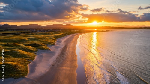 Golden Sunset Over Sandy Beach And Rolling Green Hills