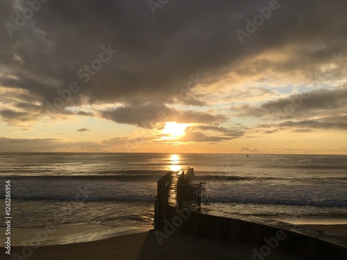 Seawall At Sunset
