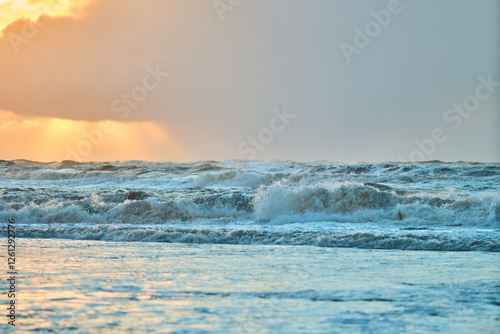 Fototapeta Naklejka Na Ścianę i Meble -  Sunset over north sea waves in Denmark. High quality photo