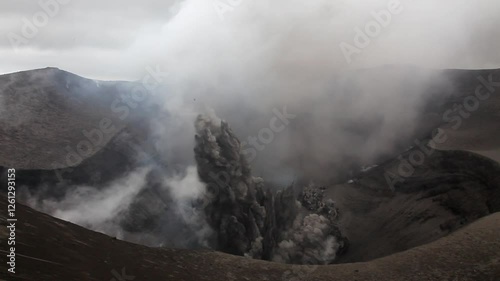 Ash-rich eruptions from rim of active crater on Mount Yasur volcano in Vanuatu.