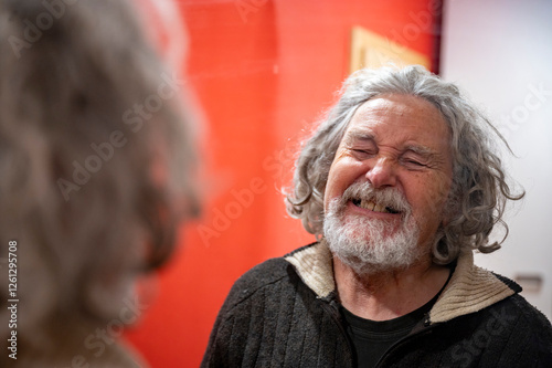 Elderly man smiling in the mirror photo