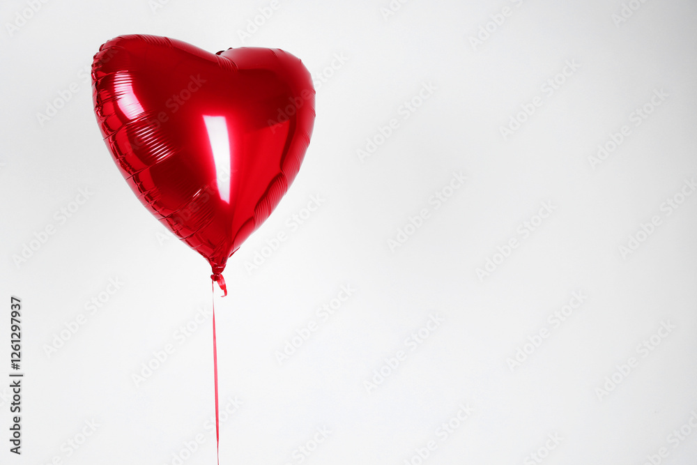 Heart-shaped red balloon on white background, space for text. Valentine's day