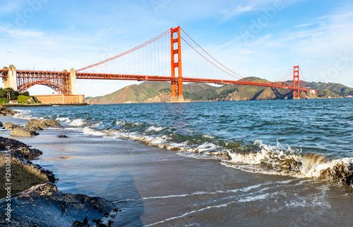 Surf in front of Golden Gate Bridge worldwide known symbol of California