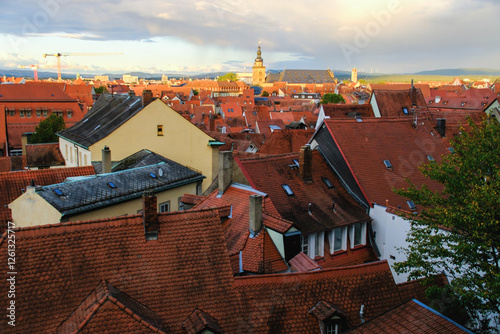 Urban Landscape with Red-Tiled Roofs and Construction Crane